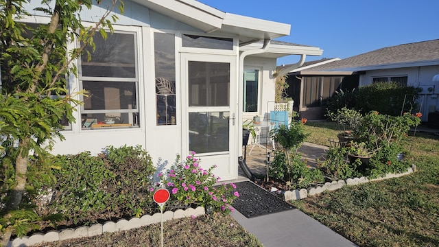 property entrance featuring stucco siding