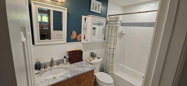 bathroom featuring toilet, vanity, and shower / bathtub combination with curtain