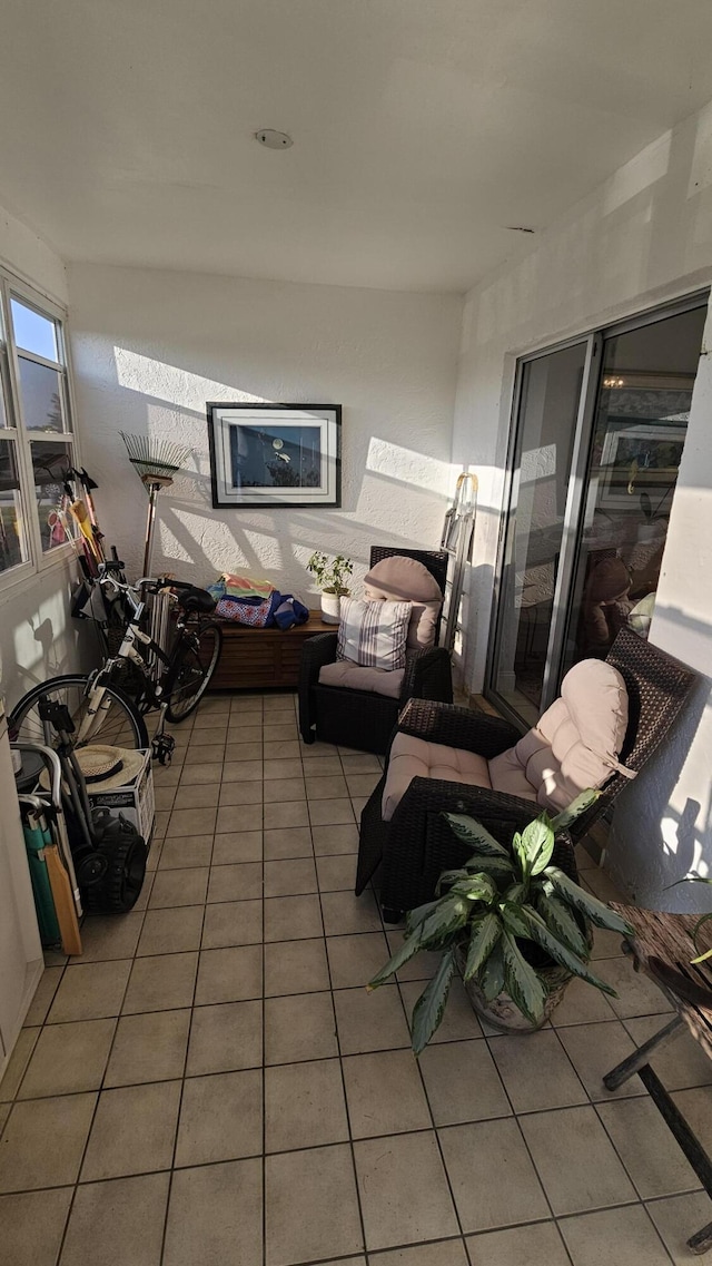 living room with tile patterned flooring