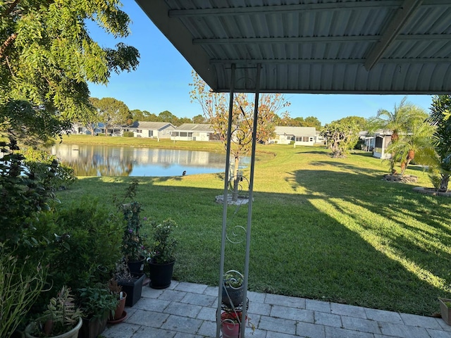 view of yard with a water view and a residential view