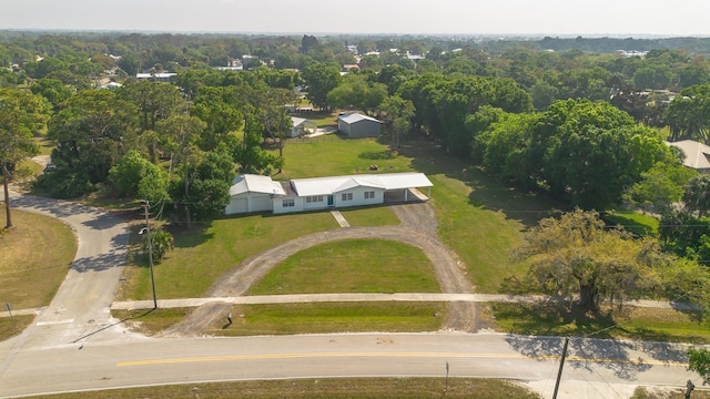 birds eye view of property with a wooded view