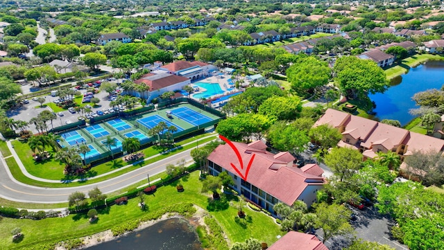 bird's eye view with a water view and a residential view