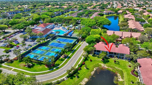 birds eye view of property featuring a water view and a residential view