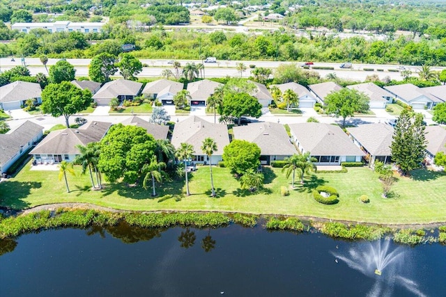 bird's eye view featuring a residential view and a water view