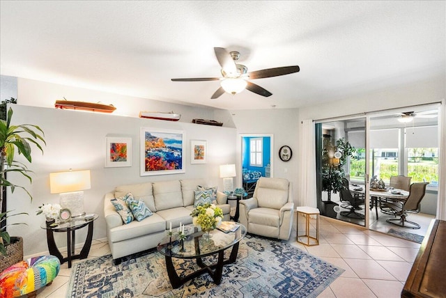 living room with light tile patterned floors and a ceiling fan