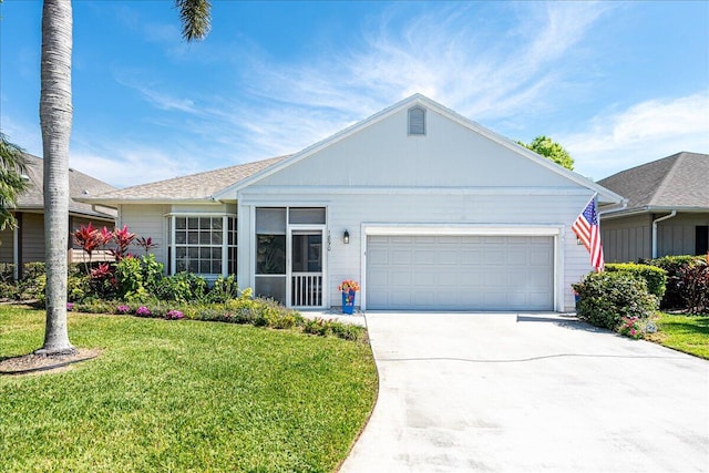 ranch-style house featuring a front yard, an attached garage, and driveway