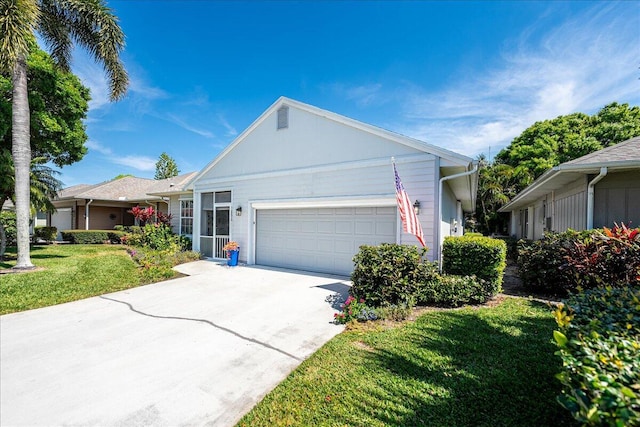 single story home with a garage, driveway, and a front yard