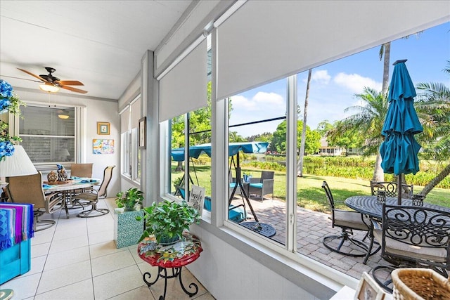 sunroom featuring plenty of natural light and ceiling fan