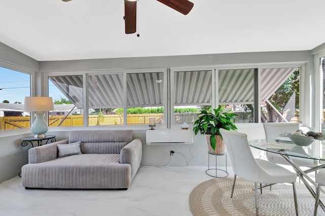 sunroom with ceiling fan