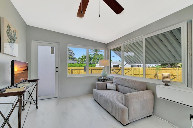 sunroom / solarium featuring ceiling fan and vaulted ceiling