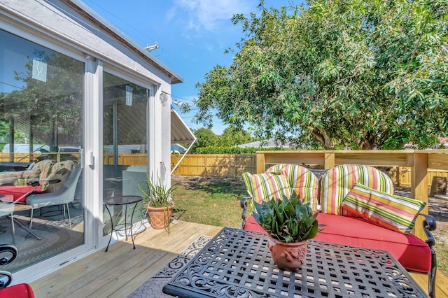 wooden terrace featuring fence