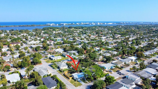 bird's eye view featuring a residential view and a water view