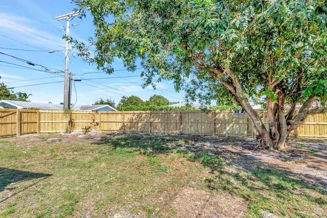 view of yard with a fenced backyard