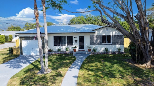 single story home with a front lawn, concrete driveway, a garage, and stucco siding