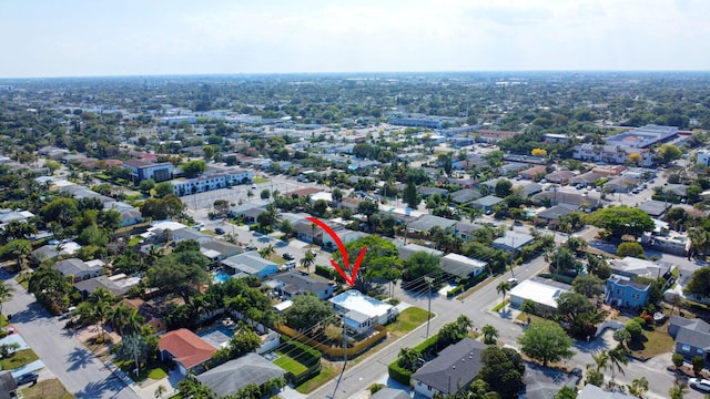 birds eye view of property with a residential view