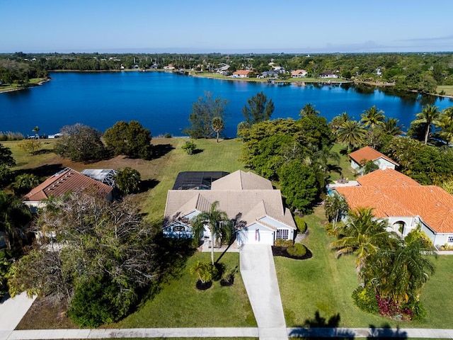 birds eye view of property with a water view