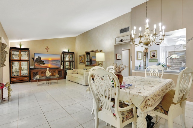 dining space with vaulted ceiling, light tile patterned flooring, ceiling fan with notable chandelier, and visible vents