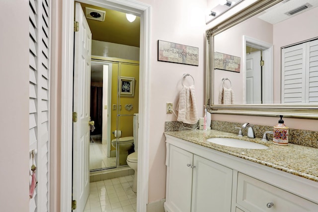 full bathroom with visible vents, a shower stall, toilet, tile patterned floors, and vanity