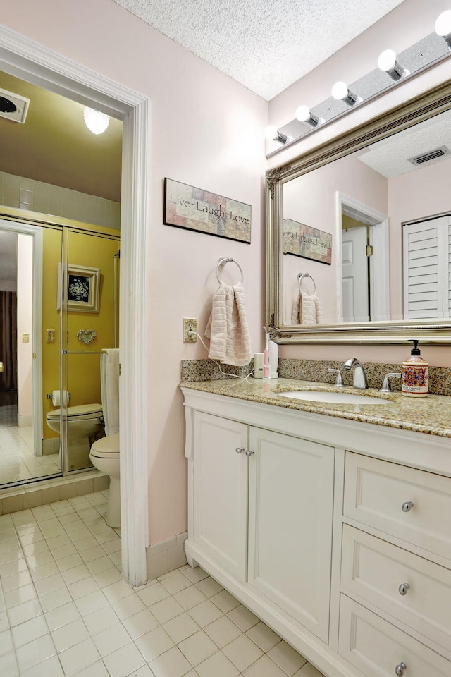 full bathroom with tile patterned flooring, visible vents, toilet, and vanity