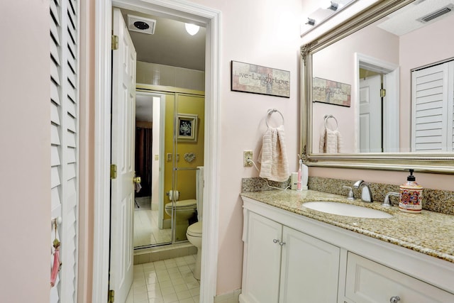 bathroom with tile patterned flooring, visible vents, a shower stall, toilet, and vanity