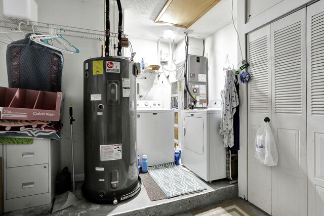 washroom featuring washer and dryer, heating unit, and water heater