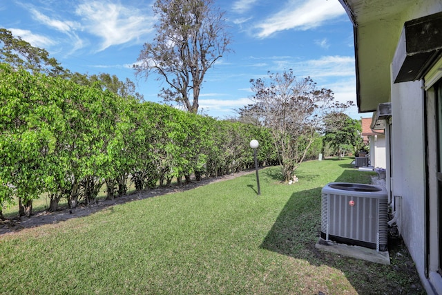 view of yard with central AC