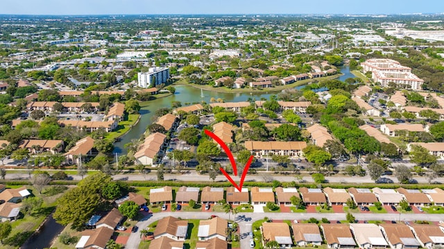 aerial view with a residential view and a water view