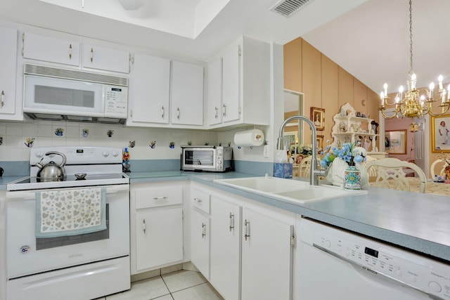 kitchen featuring white appliances, visible vents, an inviting chandelier, a sink, and white cabinets