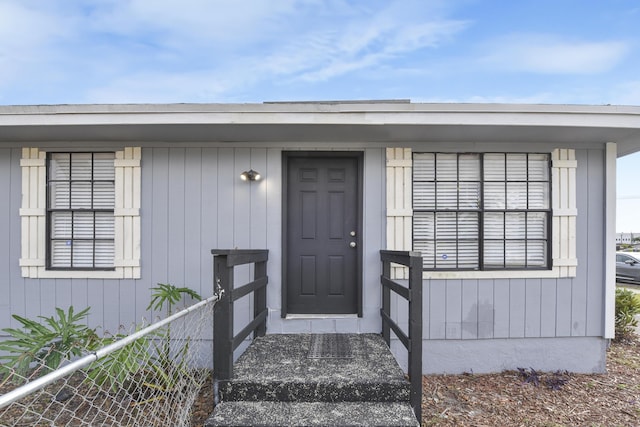 property entrance with fence