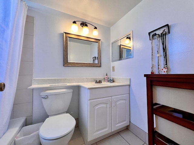 bathroom with tile patterned flooring, toilet, and vanity