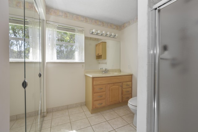 full bath featuring vanity, tile patterned flooring, a shower stall, a textured ceiling, and toilet