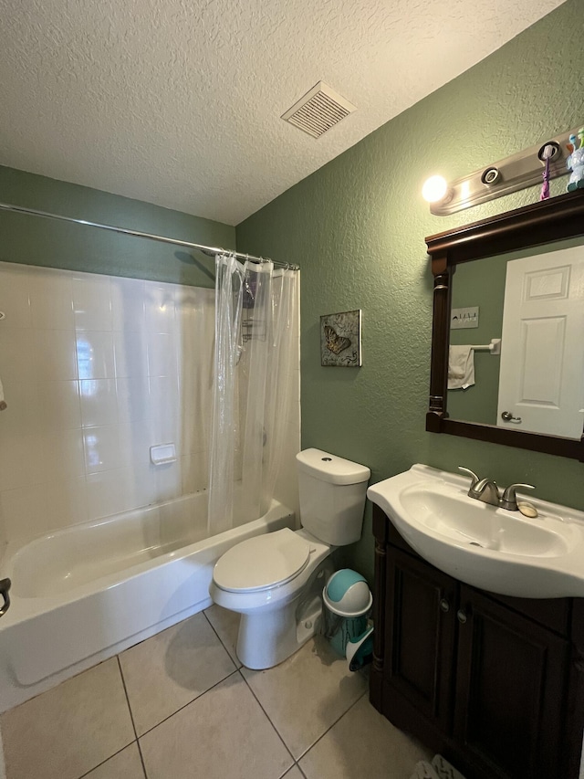 bathroom with tile patterned flooring, visible vents, shower / tub combo, a textured wall, and a textured ceiling