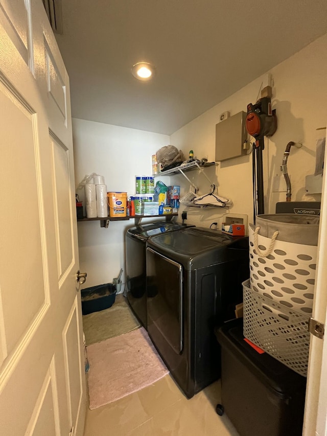 washroom with laundry area and washer and clothes dryer