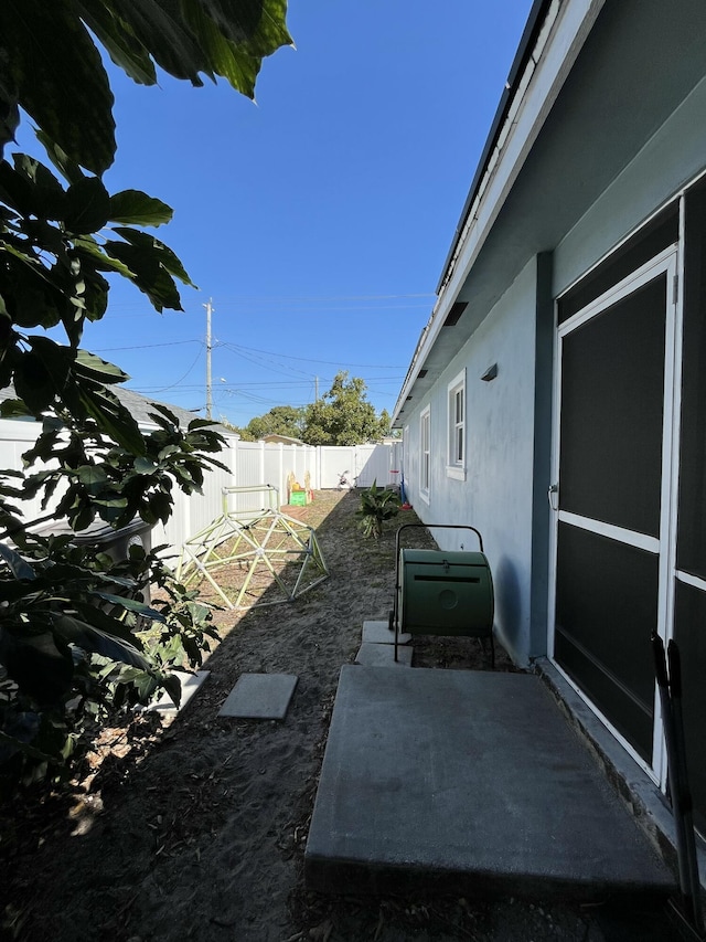 view of yard featuring a patio and a fenced backyard