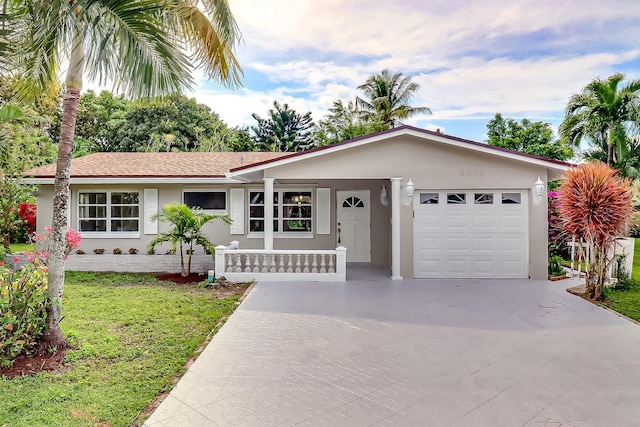 ranch-style house with stucco siding, driveway, a front lawn, and an attached garage