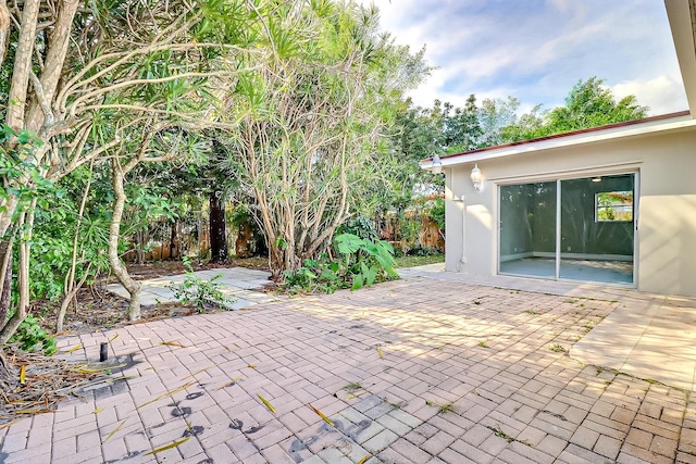 view of patio featuring fence