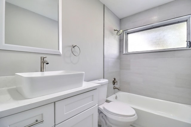 full bathroom featuring vanity, shower / bathing tub combination, and toilet