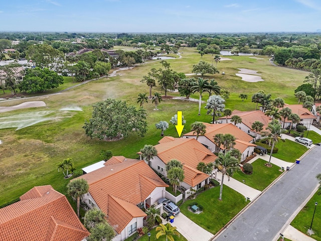 drone / aerial view featuring a residential view and view of golf course