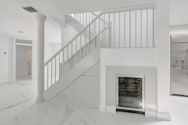 stairs featuring visible vents and marble finish floor