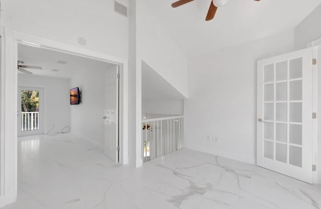 interior space featuring visible vents, marble finish floor, and ceiling fan