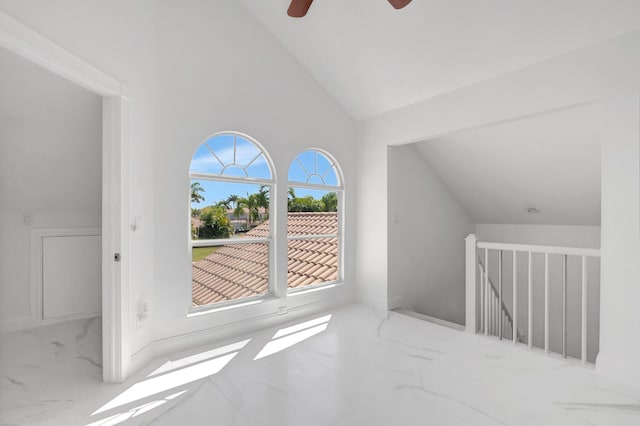 bonus room with lofted ceiling, marble finish floor, and a ceiling fan