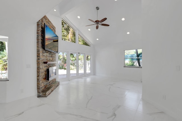 living area featuring a ceiling fan, high vaulted ceiling, recessed lighting, a fireplace, and marble finish floor