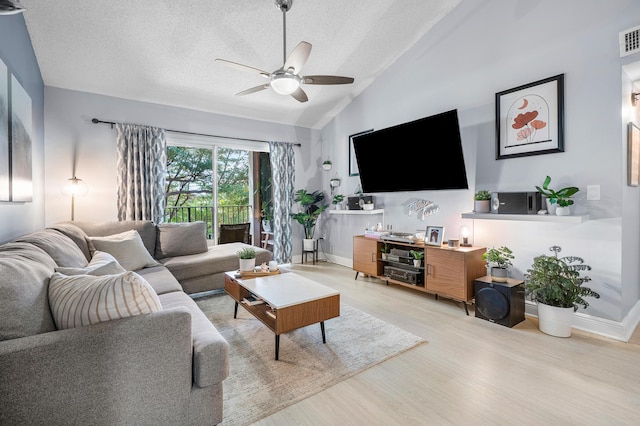 living room featuring visible vents, baseboards, ceiling fan, wood finished floors, and a textured ceiling