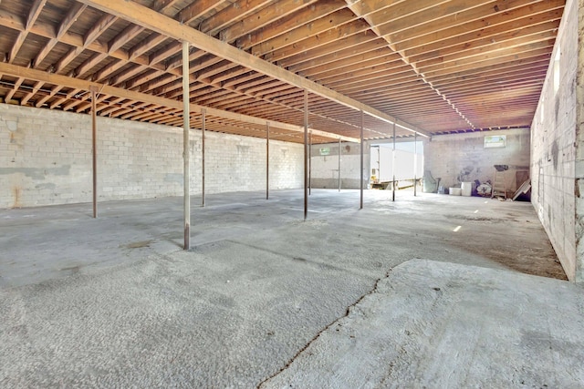 miscellaneous room featuring unfinished concrete flooring