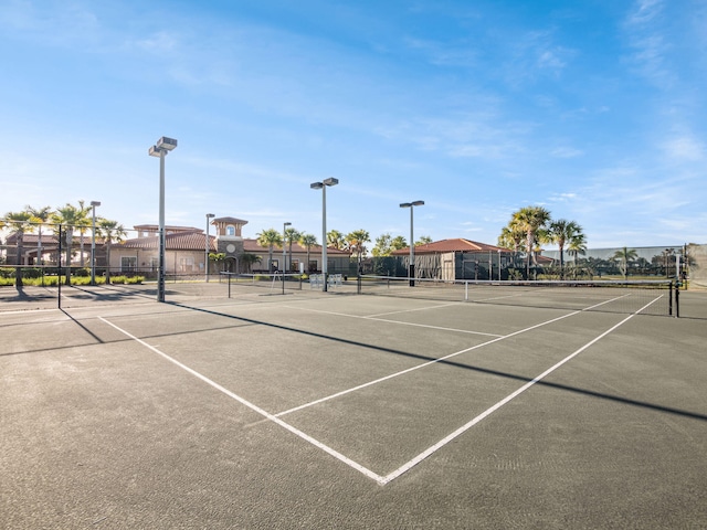 view of sport court featuring fence