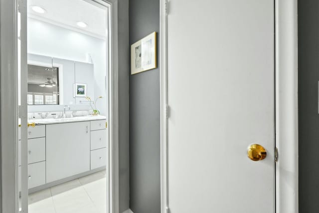 bathroom featuring tile patterned flooring, recessed lighting, and vanity