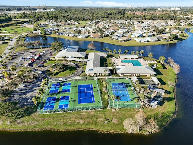 birds eye view of property featuring a residential view and a water view