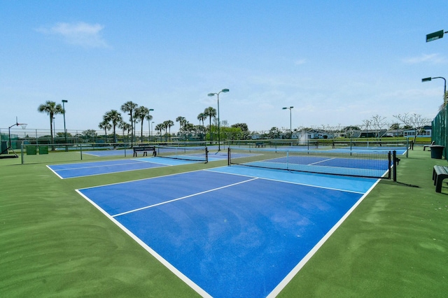 view of sport court with fence