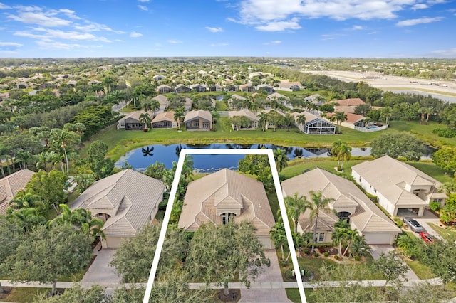 birds eye view of property featuring a residential view and a water view