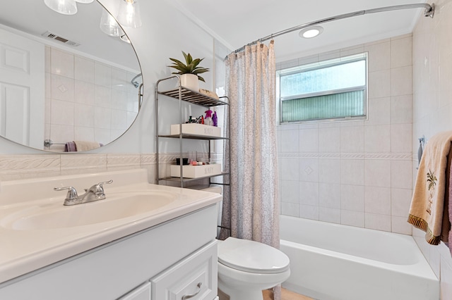 bathroom featuring visible vents, shower / bathtub combination with curtain, toilet, crown molding, and vanity